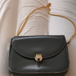 Classic Black Leather Gucci Bag with Gold Chain